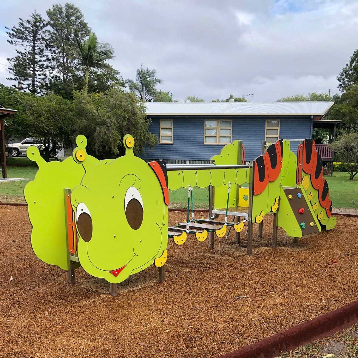 Themed playground with a playful caterpillar balance structure